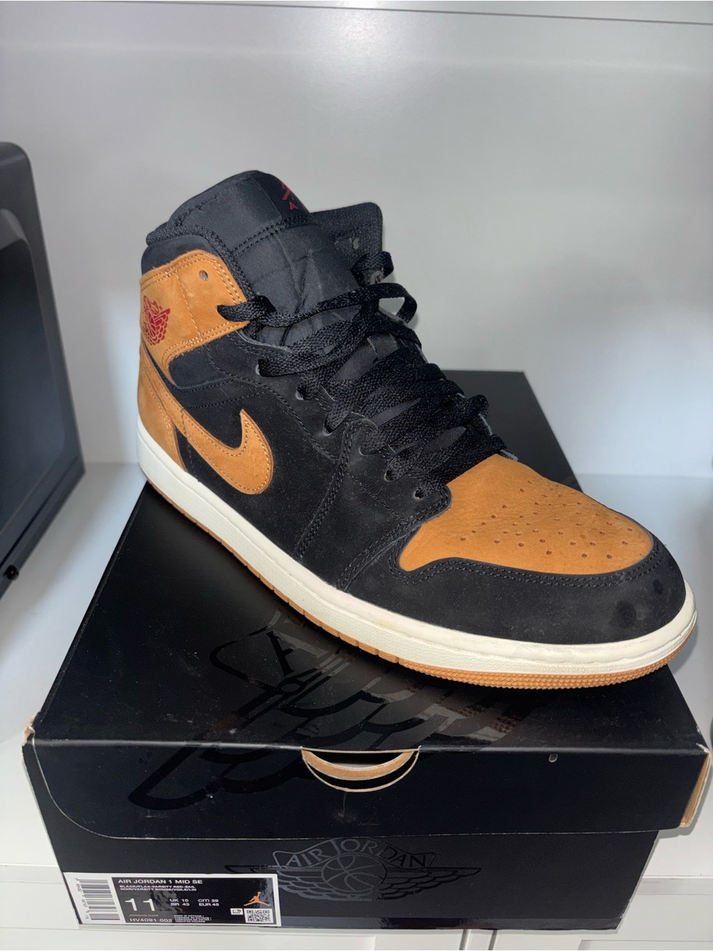 Jordan 1 Mid Men’s Black and Tan Suede Sneaker
